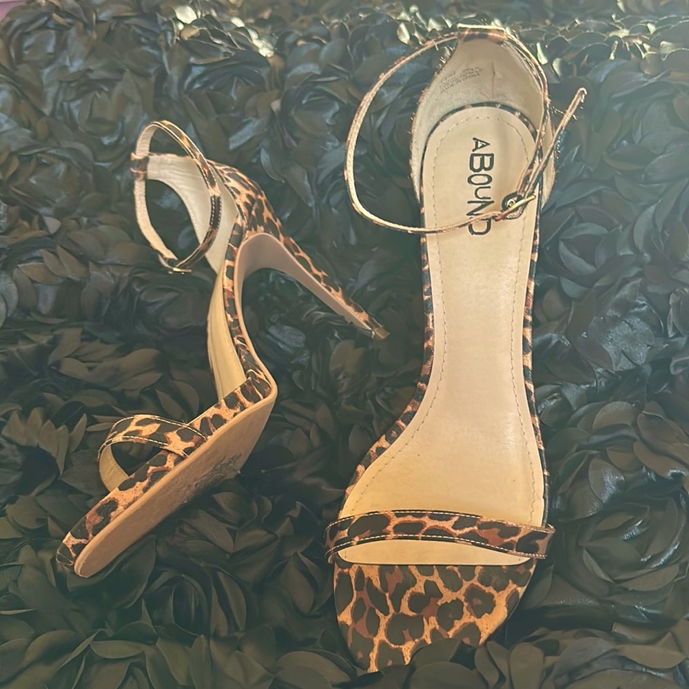 "Slim & fab leopard high heels, gently used. Roar with style."
